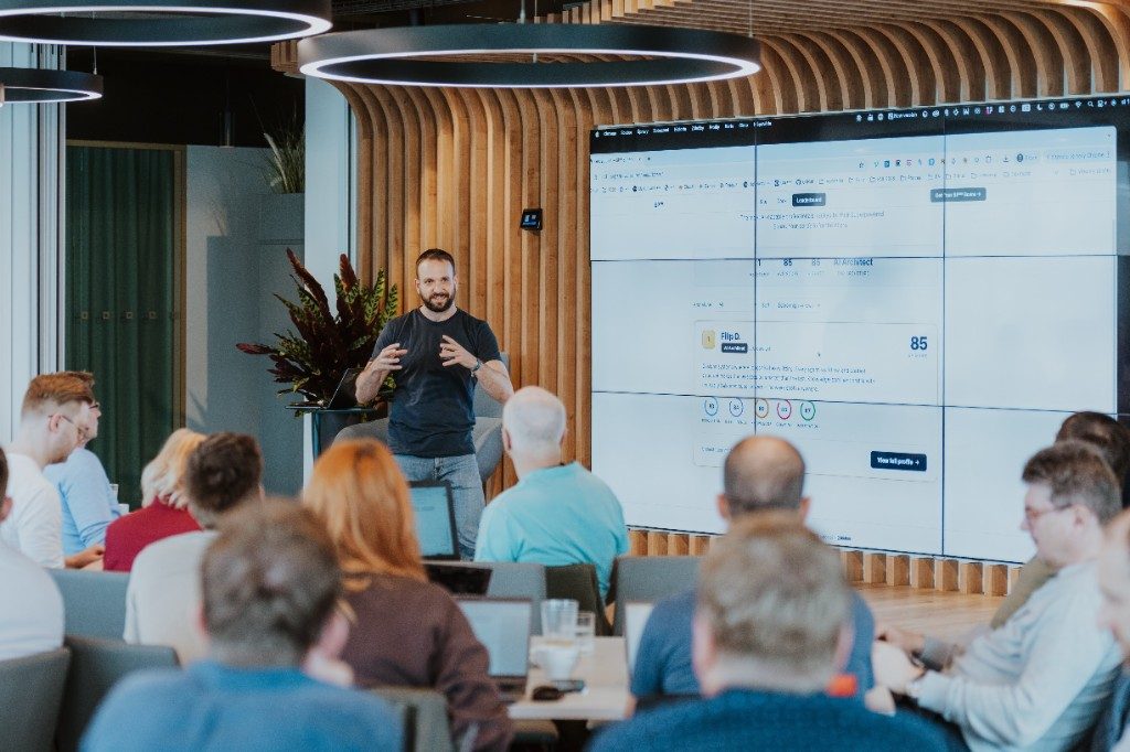 Filip Drimalka presenting Superpowered assessment results to a company team